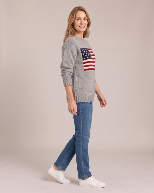 Flag Knit Jumper worn by a model, side view, Grey