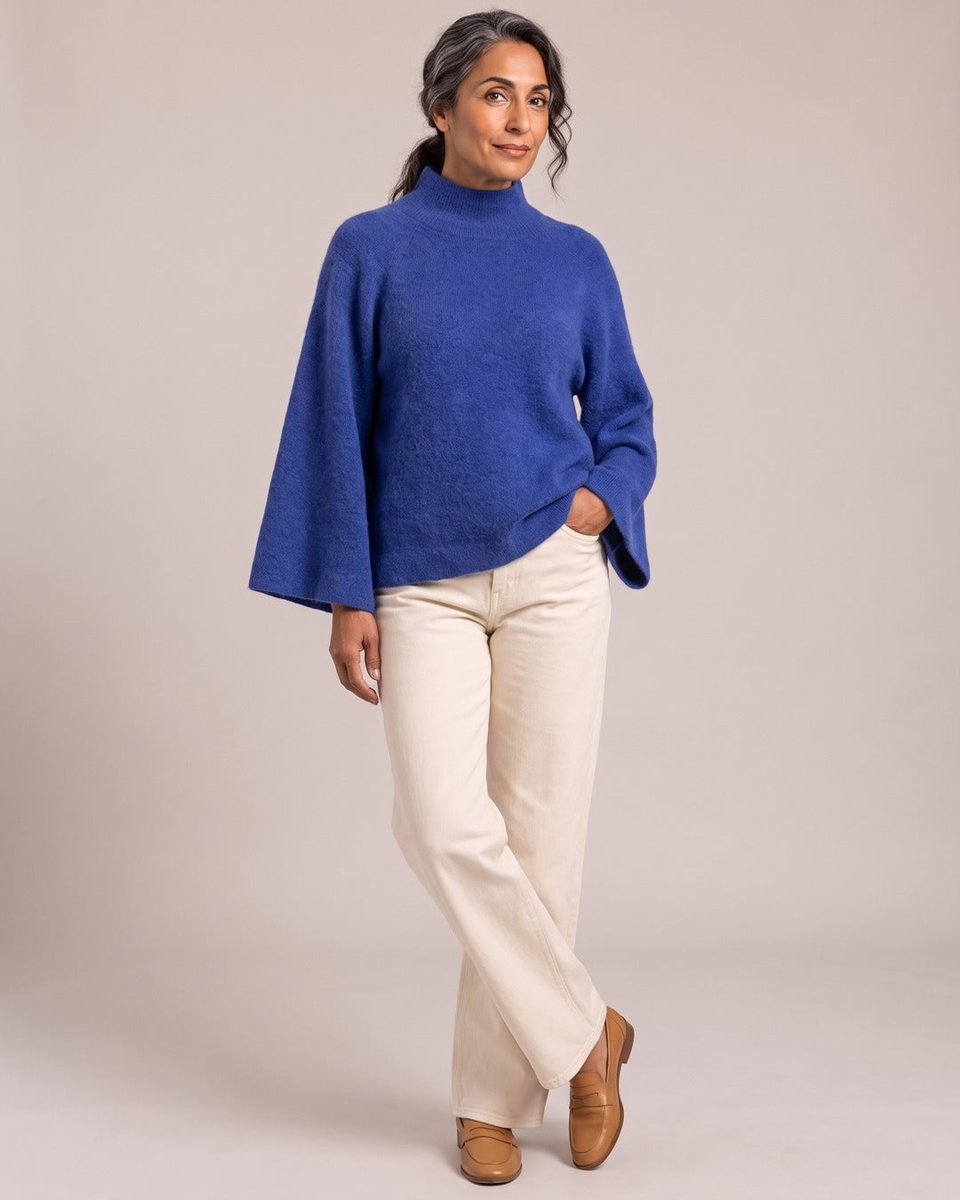 Chunky Mock-Neck Jumper worn by a model, Blue