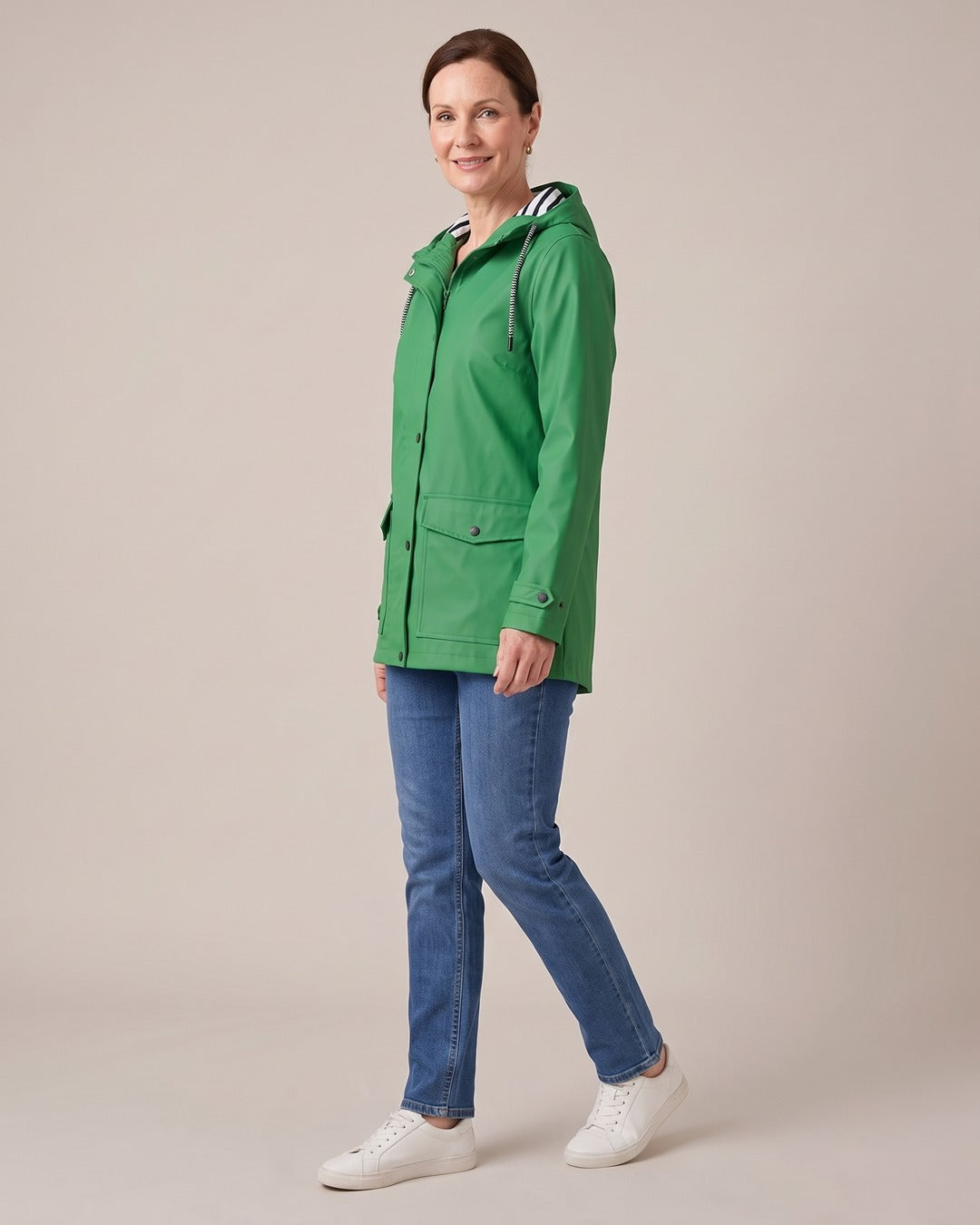 Hooded Trench Coat worn by a model, side view, Green