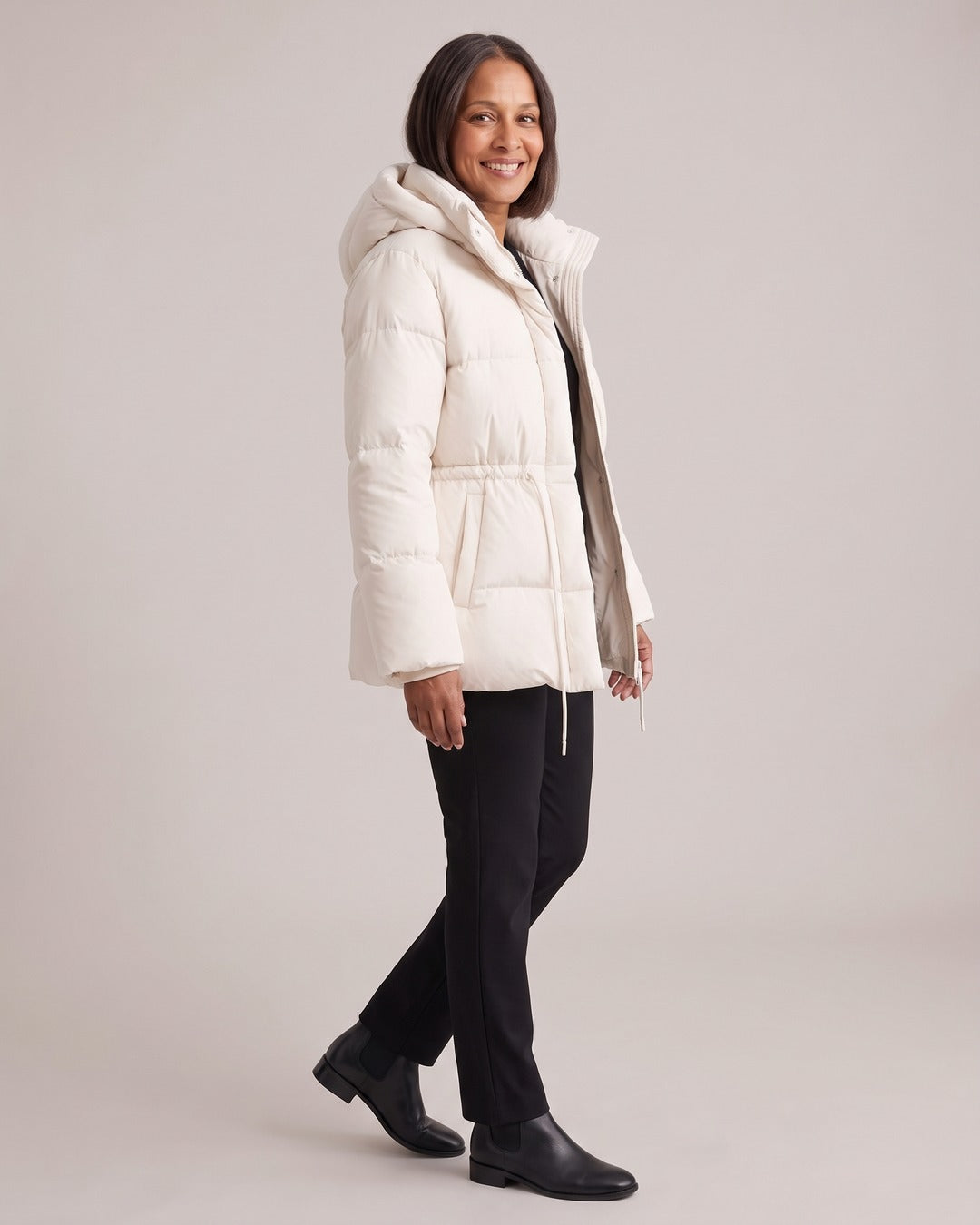 Cinched-Waist Hooded Puffer Jacket worn by a model, side view