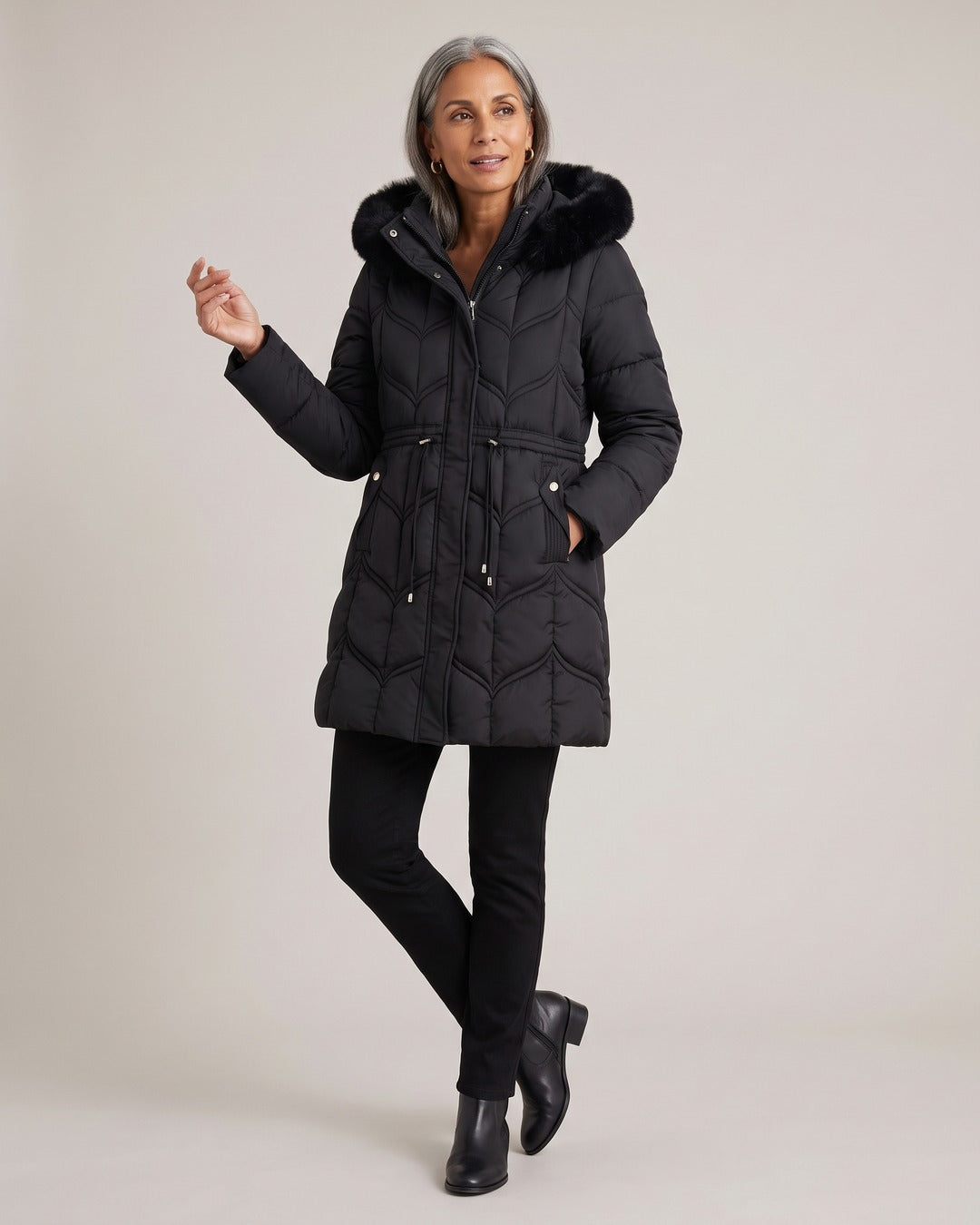 Long Puffer Coat with Faux-Fur Hood worn by a model