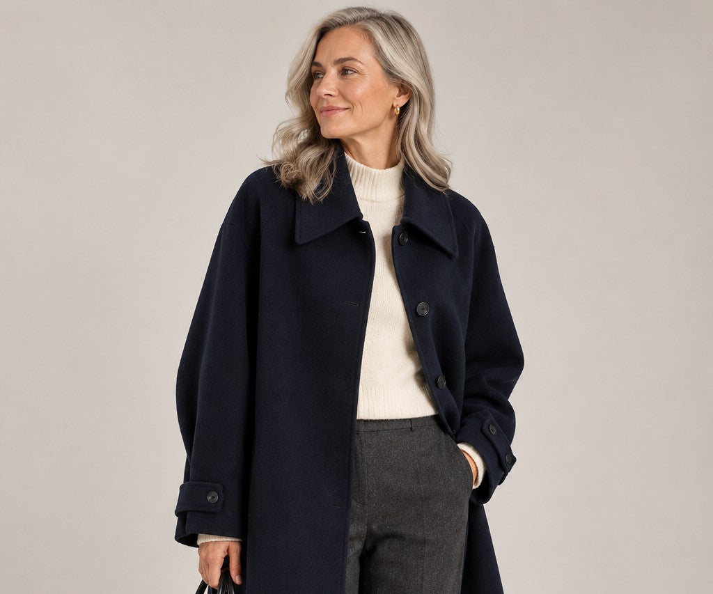 Woman in a navy classic midi coat