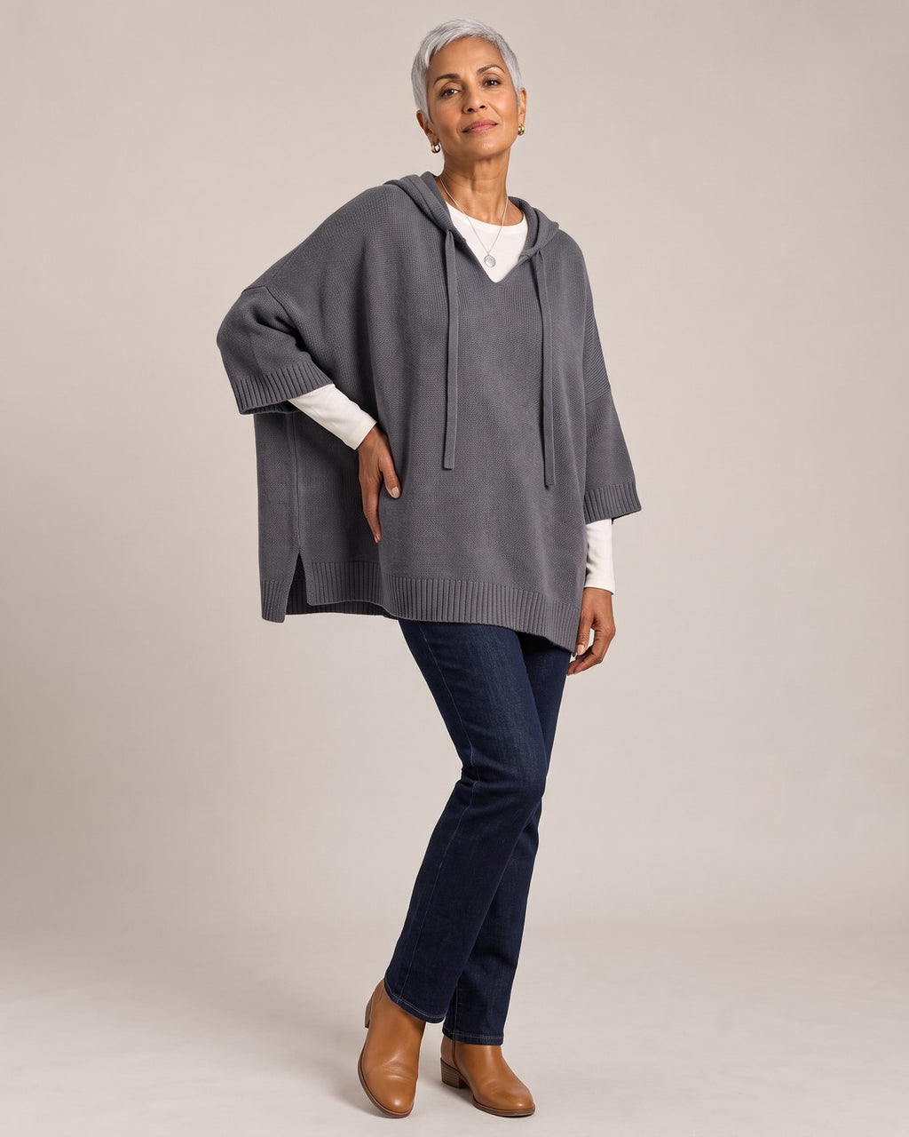 Oversized Knit Poncho Hoodie worn by a model