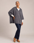 Oversized Knit Poncho Hoodie worn by a model