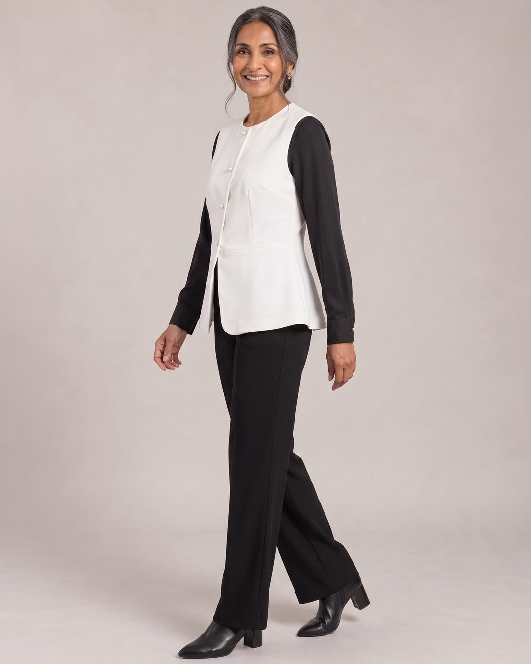 Peplum Button Waistcoat worn by a model, side view