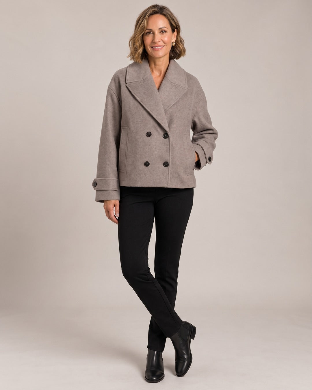 Double-Breasted Cropped Coat worn by a model