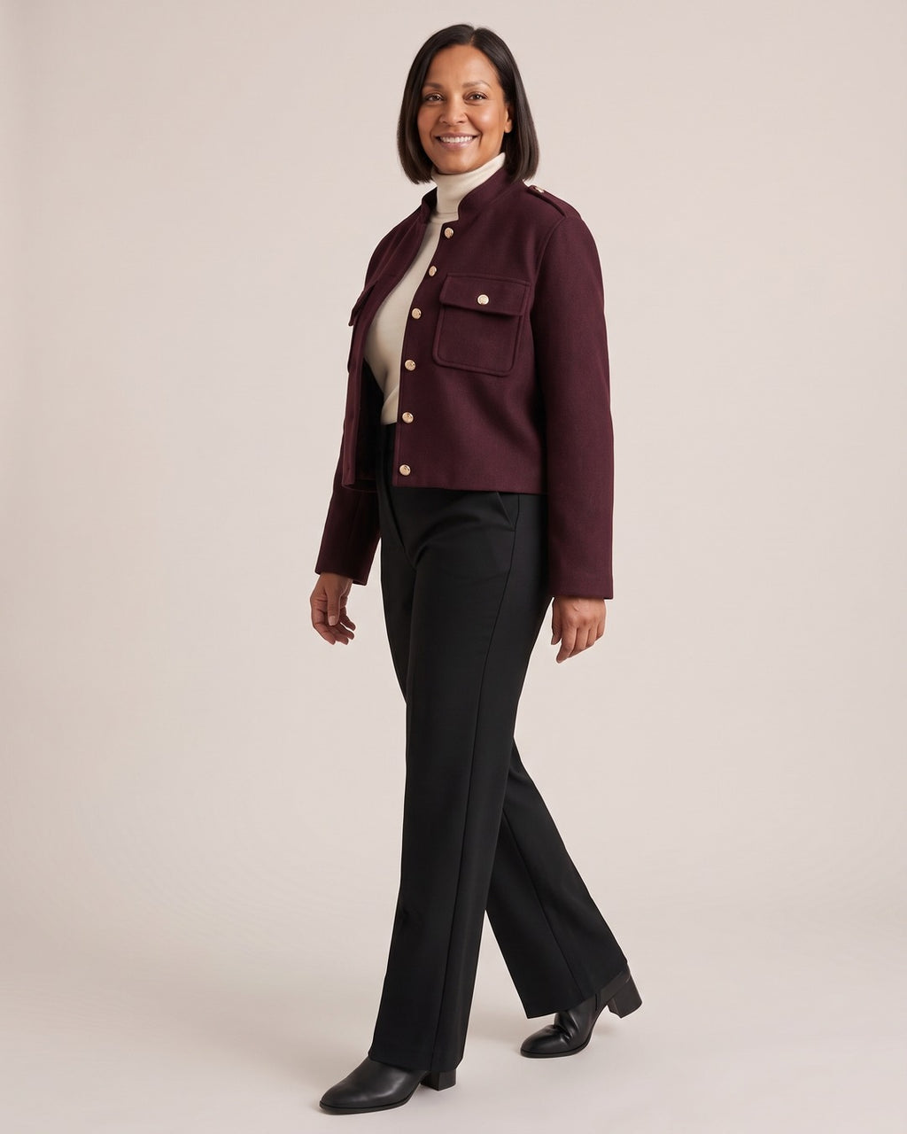Stand-Collar Cropped Jacket with Gold Buttons worn by a model, side view