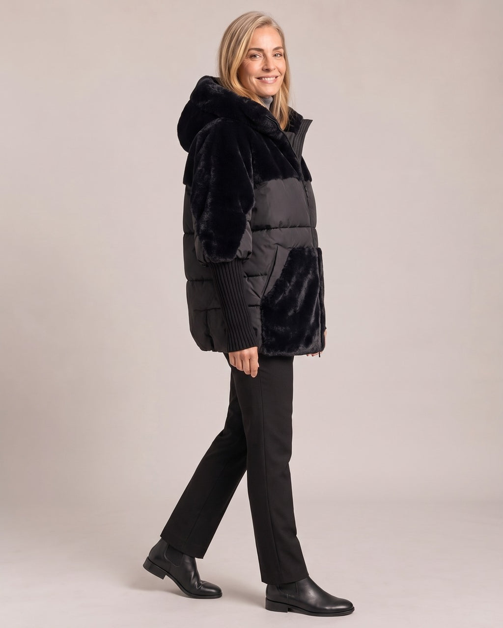 Hooded Faux-Fur Panel Puffer Jacket worn by a model, side view