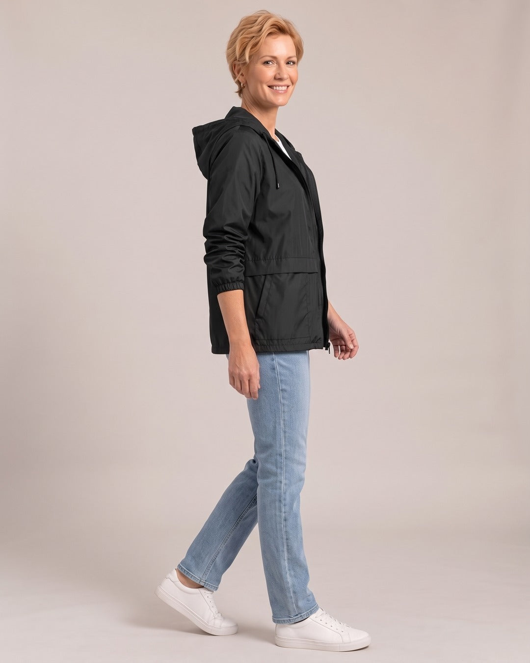 Lightweight Hooded Windbreaker Jacket worn by a model, side view, Black