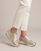 Metallic Side-Zip Wedge Trainer in Gold, worn