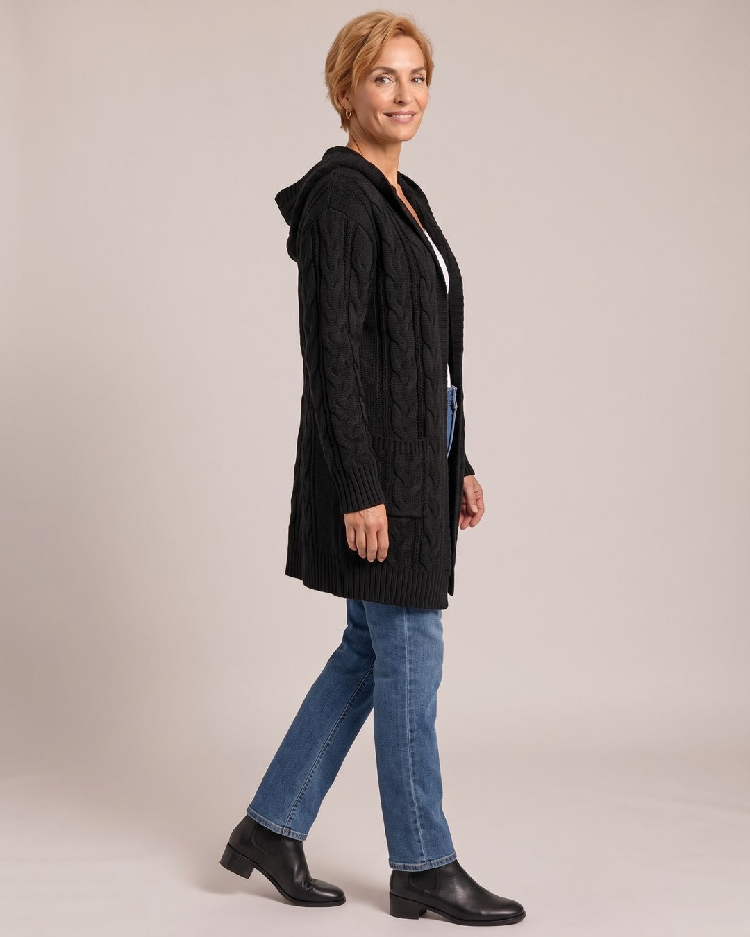 Cable Knit Cardigan worn by a model, side view, Black