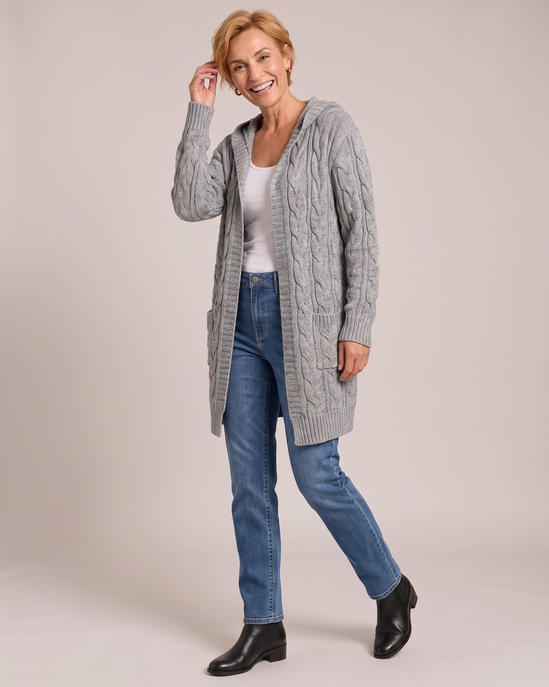 Cable Knit Cardigan worn by a model, Grey