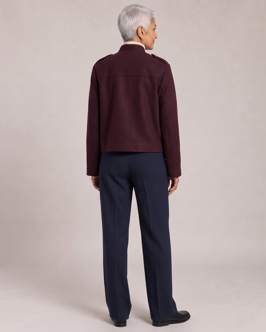 Military Cropped Jacket with Gold Buttons worn by a model, back view